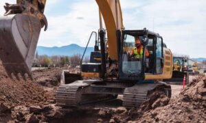 Excavator preparing a rural homesite as the property is readied for a perc test and septic system