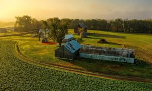 Aerial view of a rural farm with barns, fields, and access tracks, illustrating the type of property that may be divided through a subdivision survey