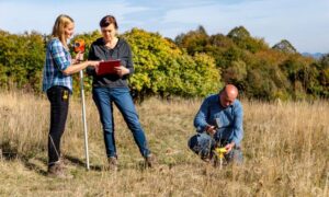 Surveyors conducting boundary survey fieldwork in South Dakota